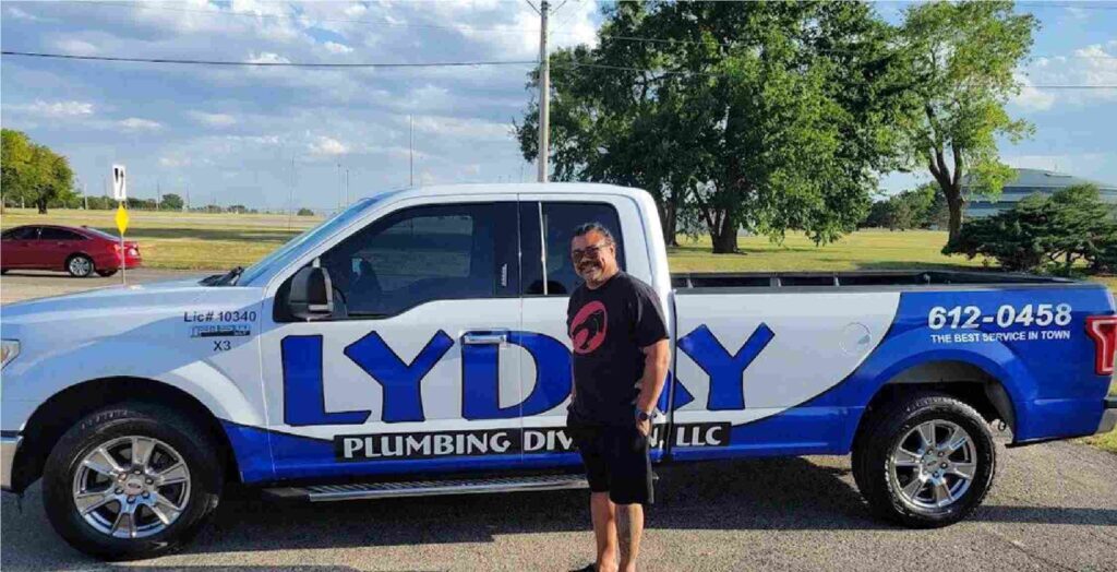 Friendly plumber from Lyday Plumbing assisting a Wichita homeowner.